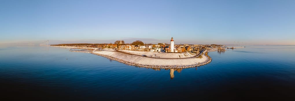 panoramic view at the Lighthouse of Urk Netherlands during winter with snow in the Netherlands.