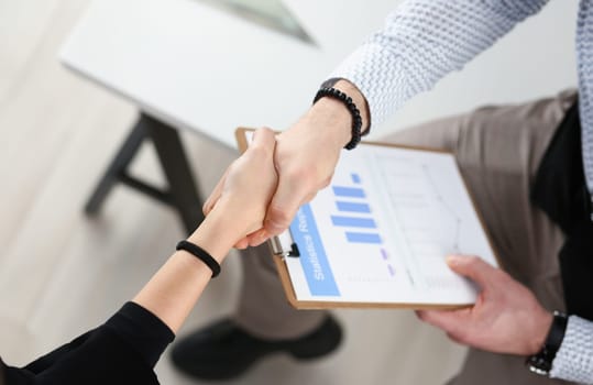 Man in shirt shake hand as hello in office closeup. Friend welcome mediation offer positive introduction greet or thanks gesture summit participate approval motivation strike arm bargain concept