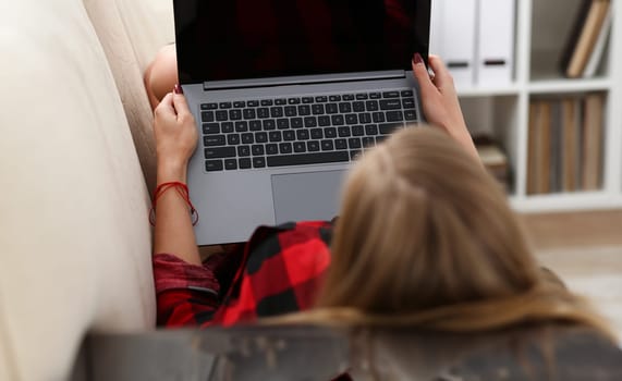 pretty blond young woman hold laptop in arms work closeup