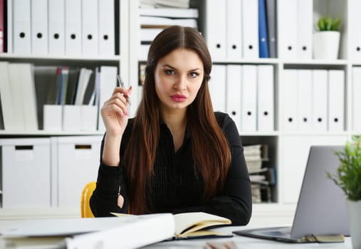 Beautiful smiling clerk girl at workplace talk to visitor looking in camera. White collar worker at workspace modern lifestyle client offer startup project irs audit student study creative discussion