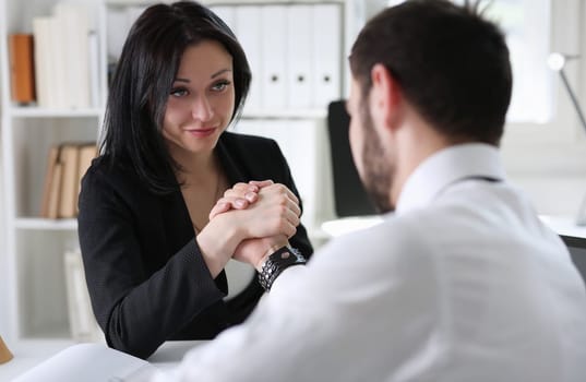 business partneers man and woman make handshake. They have deal