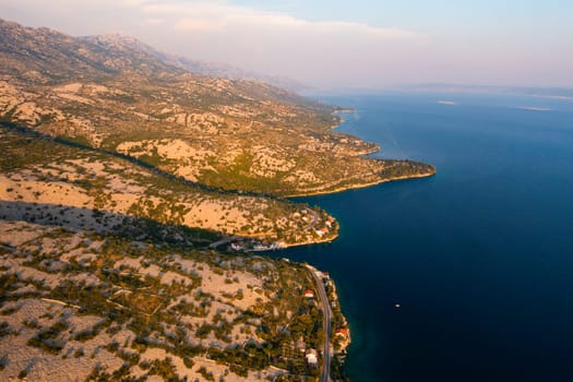 Aerial view of rocky coastline and clear waters in the serene landscape of Dalmatia, Croatia.