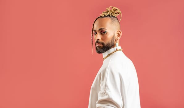 Trendy black latin gay man in white clothes look camera isolated on pink background studio portrait People lifestyle fashion lgbtq concept