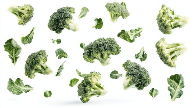 Fresh broccoli florets and leaves on a white background, healthy food concept.