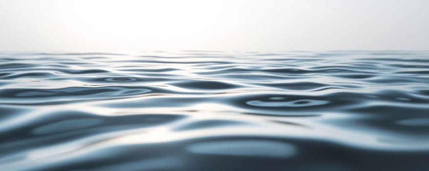 Calm ocean waves reflecting sky during sunrise, close-up view. Serene nature and tranquility concept.