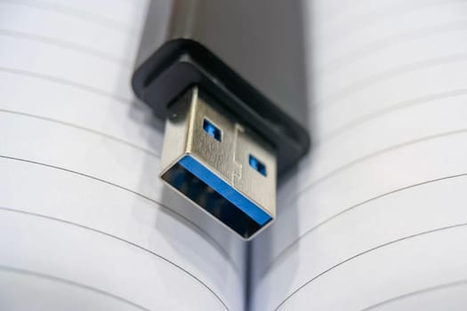 USB 3.0 Flash Drive Close-up. Metal connector and black case details of a USB 3.0 flash drive. This image is perfect for explaining data transfer, portable storage solutions and modern technology concepts.