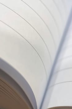A close-up of notebook pages forming a soft, wavy pattern. A useful image for themes of education, knowledge, and simplicity.