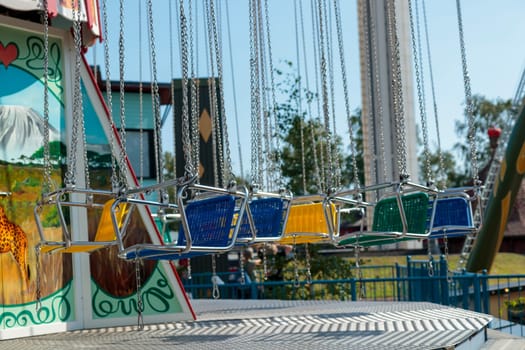 Helsinki, Finland - 19 AUGUST 2024: Linnanmaki amusement park with carousel Ketjukaruselli, empty