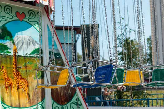 Helsinki, Finland - 19 AUGUST 2024: Linnanmaki amusement park with carousel Ketjukaruselli, empty