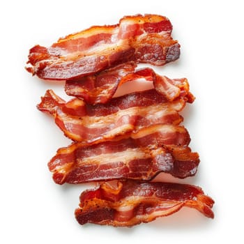 Several slices of cured bacon in a pile on a white background. The bacon slices are thin, translucent and pink with streaks of white marbling