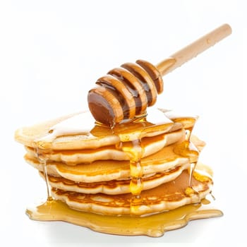 Top view of a stack of pancakes with honey dripping from a wooden dipper, isolated on a white background