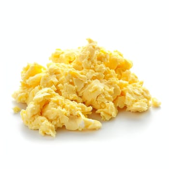 Close-up of scrambled eggs on a white background, well-cooked and fluffy