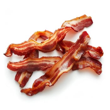 Crispy fried bacon strips isolated on a white background, top view