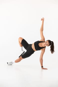 Smiling healthy woman doing yoga at home. pilates