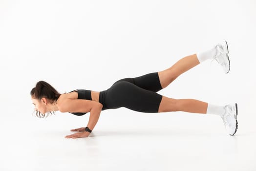 Smiling healthy woman doing yoga at home. pilates