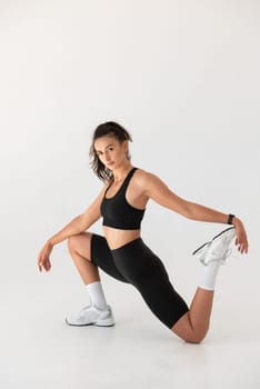 Smiling healthy woman doing yoga at home. pilates