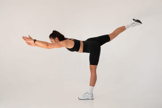 Smiling healthy woman doing yoga at home. pilates