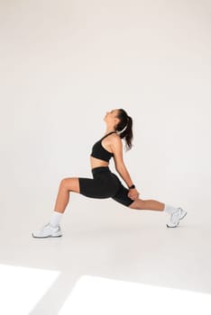 Smiling healthy woman doing yoga at home. pilates