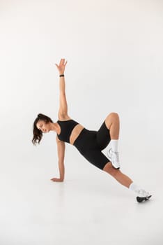Smiling healthy woman doing yoga at home. pilates