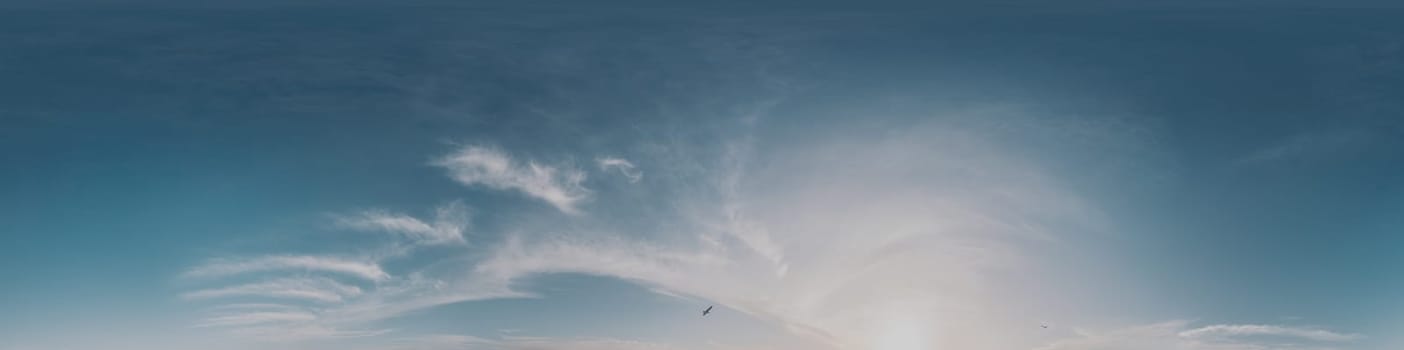 360 panorama of glowing sunset sky with bright Cirrus clouds. Seamless hdr spherical 360 panorama. Sky dome in 3D visualization, sky replacement for aerial drone panoramas. Weather and climate change.
