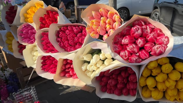 Selling bouquets of tulips on the city street