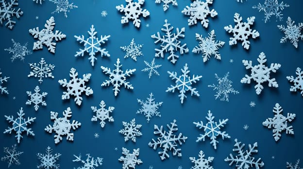 Snowflakes are falling down on a blue background.