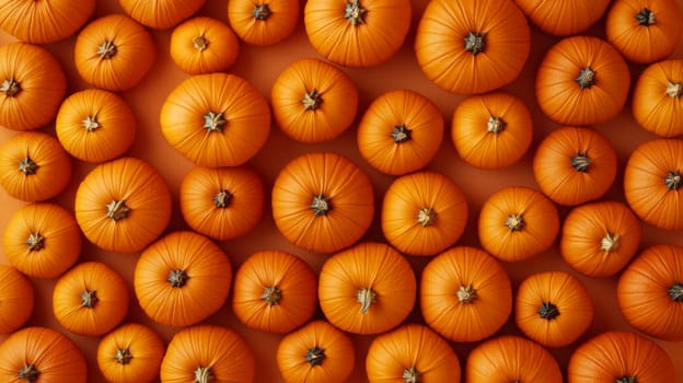 Orange pumpkins arranged in a pattern, top view. Autumn harvest and halloween concept.