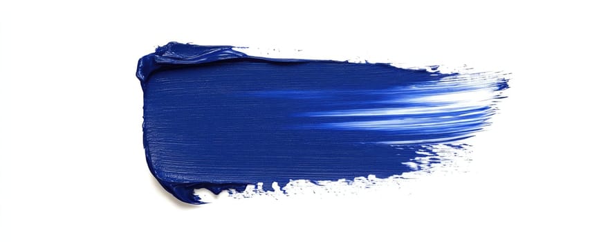 Blue paint brush stroke texture on white background for creative design projects.