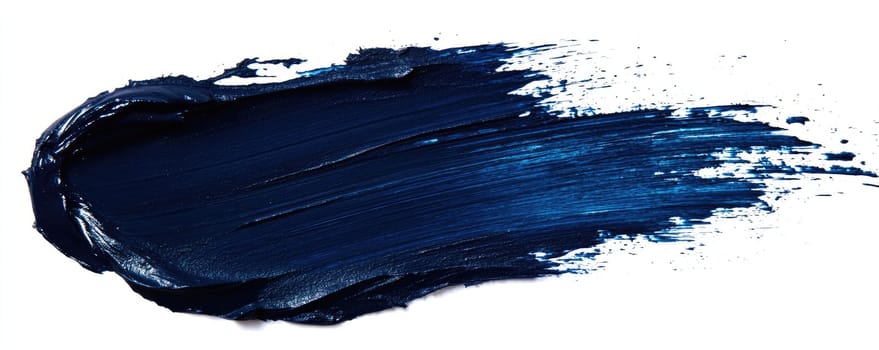 Bold blue paint brush stroke texture on white background for artistic design.