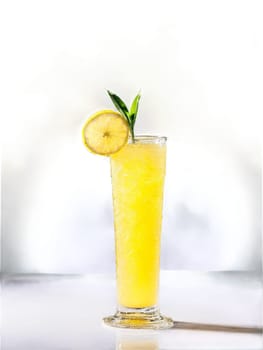 Lemon Ginger Bright yellow cocktail in a tall slender glass garnished with a slice. Drink isolated on transparent background.