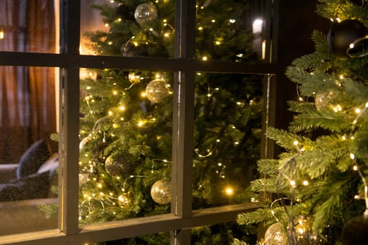 Balls on the Christmas tree close-up. Christmas tree design decorations. The concept of celebrating New Year and Christmas