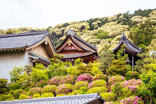 The iconic Kiyomizu-dera temple and mountain view on a sunny spring day in Kyoto, Japan