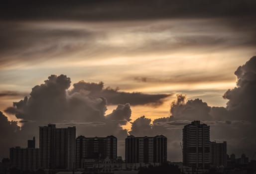 Bangkok, Thailand - 22 Aug, 2024 - Silhouette view of Modern high-rise buildings and background of Dramatic sky in the city of Bangkok. Picturesque view of skyscrapers before Sunset. use it as your Wallpaper, Poster and Space for text, Selective focus.