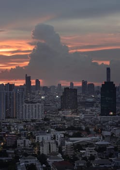 Bangkok, Thailand - 23 Aug 2024 - View of Beautiful Clouds in the Sky over Large Metropolitan City. Bangkok city skyscrapers after sunset with Dramatic sky background before Sunset, Space for text, Selective focus.