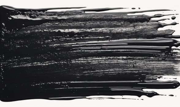 A thick stripe of black paint is spread across a white surface. The paint has been applied in a thick layer, and there are visible brushstrokes