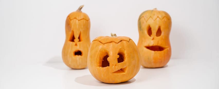 Three jack-o-lantern on a white background. Halloween decoration