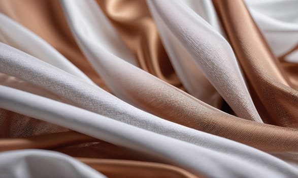 A close-up of draped fabric in white and brown. The fabric is translucent and creates a soft, flowing texture. The light catches the folds and highlights the subtle differences in the fabric's weave.