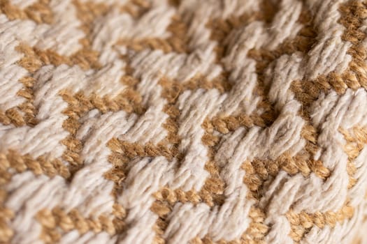 Wallpaper for textile products. Space for copy.Decorative background of rustic fabric in beige tones . High quality horizontal photo.Autumn-colored warm wool blankets.