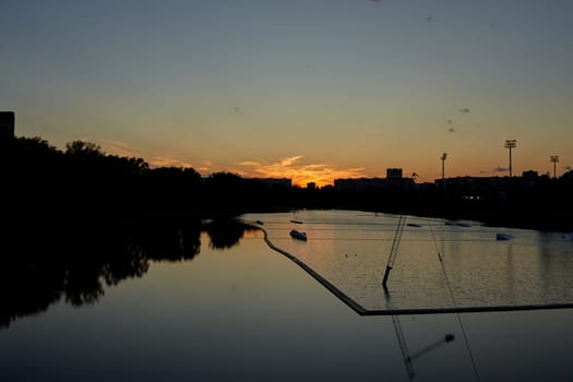 Beautiful and serene sunset reflected in the waters of a lagoon in the evening