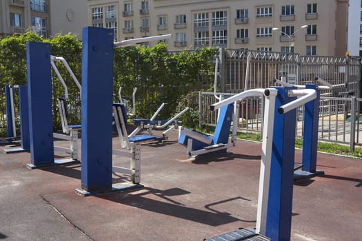 Blue metal sports equipment on the outdoor playground. Outdoor sports activities.