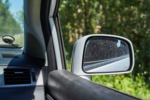 Car side mirror represents reflection, safety and the visual extension.