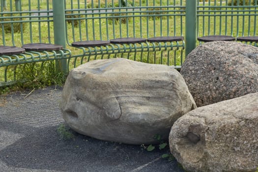 Garden Bench Made of stucco stone the gazebo is forged green. a place to relax