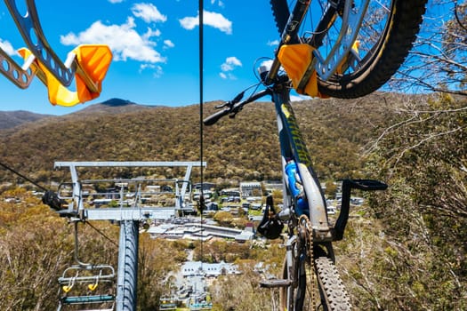 THREDBO, AUSTRALIA - DECEMBER 15 2023: Chairlifts for mountain biking summer season at Thredbo on a warm summer's day in the Snowy Mountains, New South Wales, Australia