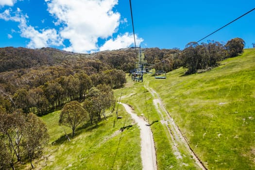 THREDBO, AUSTRALIA - DECEMBER 15 2023: Chairlifts for mountain biking summer season at Thredbo on a warm summer's day in the Snowy Mountains, New South Wales, Australia