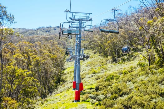 THREDBO, AUSTRALIA - DECEMBER 15 2023: Chairlifts for mountain biking summer season at Thredbo on a warm summer's day in the Snowy Mountains, New South Wales, Australia