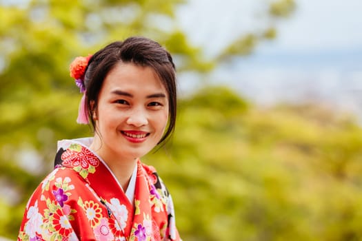Kyoto, Japan - May 14 2019: Young lady in a kimono in the streets of Kyoto on a warm spring day in Japan
