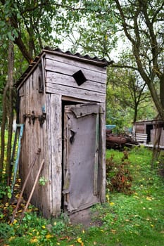 Old wooden toilet in the garden outdoors outdoors