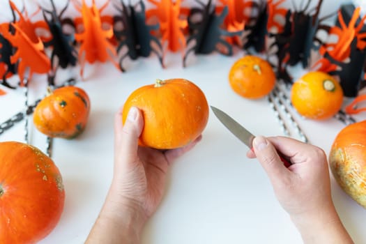 Halloween October 31st. The step-by-step process of carving a pumpkin. View from above