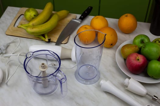 Photo of fruits and blender parts for making sport cocktail. Healthy food from simple ingredients. Smoothies and fruit juice for getting vitamins at home