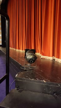 theater stage, red curtain, lamp, footlights, room, interior objects. High quality photo
